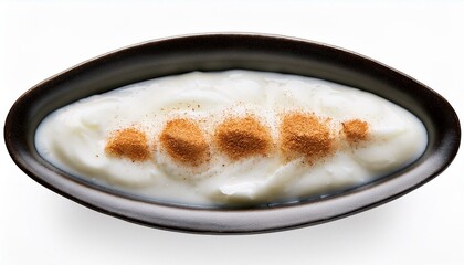 extreme top view of hyperrealistic sweet coconut pudding in a dark ceramic dish isolated on a white white background