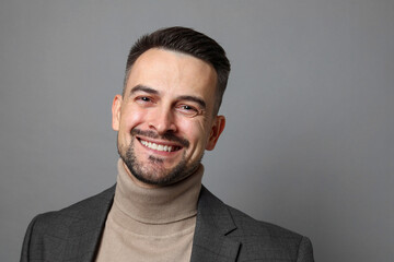 Obraz premium Portrait of handsome middle aged man on grey background, space for text