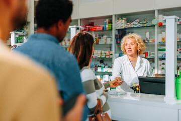 People in line in pharmacy.