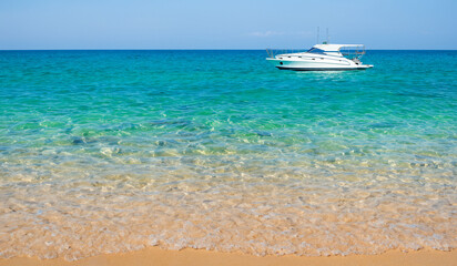 Summer beach aquamarine cyan blue crystal clean ocean water seascape with white yacht on the sea nature beauty lifestyle background texture website design 