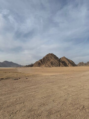a large stone mountain in the desert