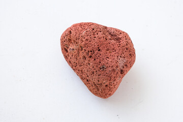 red vulcanic uneven porous stone lava isolated on white background suitable for architecture, industry, decoration