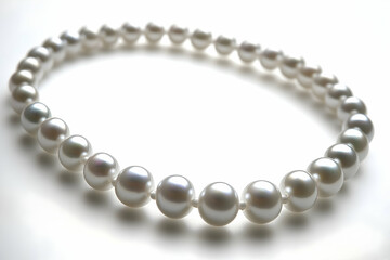 Elegant pearl necklace on white background