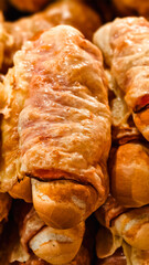A wonderful appetizer in the form of a baguette covered with bacon and cheese slices baked in the oven or microwave.