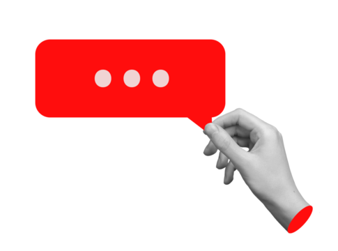 Hand holding a red speech bubble, negative feedback, bad review, or online criticism. Concept of communication, gossip, or toxic comments. Isolated on white background.