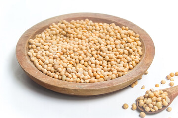soybean seeds in wooden bowl on white background
