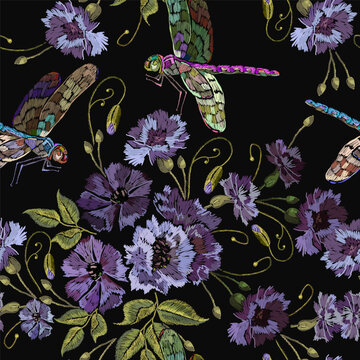 Embroidery blue flowers and dragonflies. Summer forest background. Fashionable template for design of clothes. Beautiful cornflowers