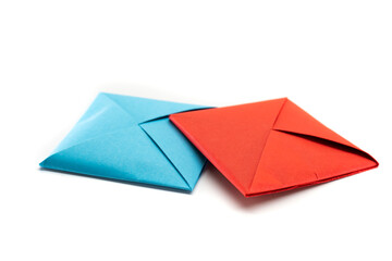 Square envelope made of red and blue paper. Origami envelope on white background