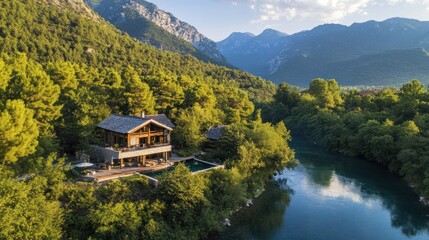 Fototapeta premium Luxury Mountain River House: Secluded Getaway in Majestic Scenery