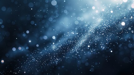 Obraz premium A mesmerizing abstract background featuring softly blurred small bokeh circles in shades of dark blue, light blue, and white