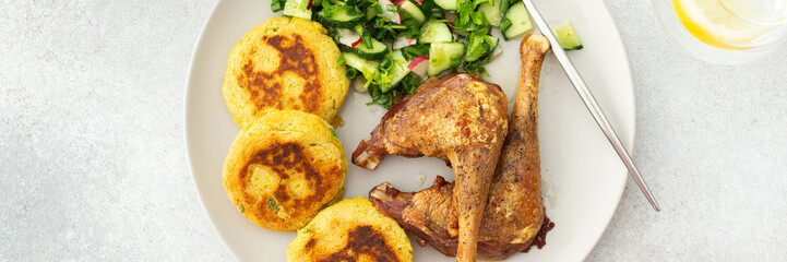 Chickpea cutlets with mixed salad with cucumbers and radishes, baked farm chicken legs, a delicious hearty lunch or dinner, banner