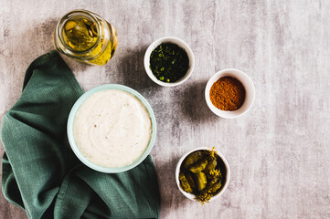 Traditional ranch dressing made with cottage cheese and pickles in a bowl top view
