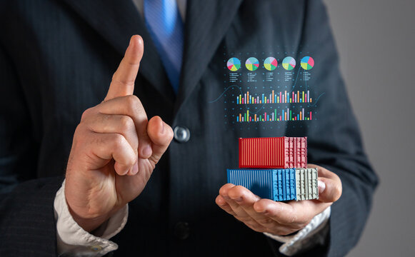 The businessman presents financial indicators and results for trade and cargo transportation. Shipping revenue, logistics performance, freight costs, supply chain analysis, transportation investment