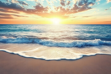 Fototapeta premium Beautiful sunset over the ocean with waves and sand on the beach background, a summer vacation concept