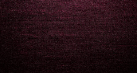 Fototapeta premium A burgundy background with dark maroon silk fabric and rich textures, including dark red, purple, crimson, violet, pink, and magenta hues, creates a luxurious atmosphere with deep, elegant tone