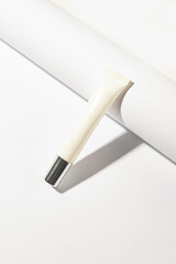 Minimalist skincare tube mockup on a clean white background, perfect for branding and packaging design.