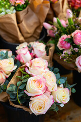 Bouquets of pink-edged roses on display
