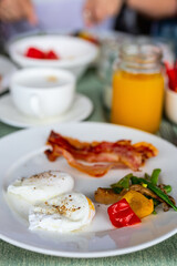 Breakfast with poached eggs and bacon