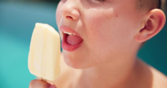 Lick, ice cream and mouth of kid by pool for summer, holiday and travel in hotel for outdoor tourism. Closeup, taste and boy child eating vanilla sucker, popsicle or frozen snack on weekend vacation