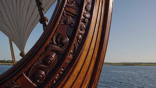 Intricate Dragon Carving on the Wooden Stern of a Viking-Style Ship
