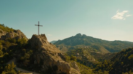 Obraz premium Religious cross on mountaintop overlooking valley