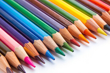 Fototapeta premium Rainbow of Colored Pencils: A vibrant collection of colored pencils, sharpened to points, arranged in a neat row showcasing their rich hues and textures. A perfect image for projects related to art.