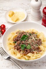 close up of tagliatelle pasta with slow cooked beef ragout