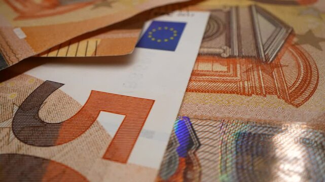 Euro banknotes of different denominations during counting in the counting machine. The currency of the European Union. Close-up
