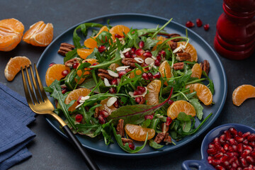 vegetarian tangerine, ruccola, nuts and pomegranate salad