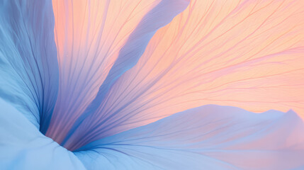 Close-up view of soft, pastel blue and peach fabric, creating flowing, wave-like patterns.