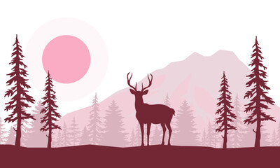 Wild Deer Standing Against the Background of Mountains and Trees