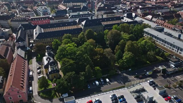 Aerial drone view of Stiftung Juliusspital W&uuml;rzburg, Germany. This architectural landmark features Baroque buildings, a grand courtyard, and lush vineyards. 