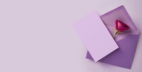 Open Lilac Paper Envelope with sheet of paper and rose petals on romantic background. Design template for greeting card, banner, flyer, poster etc.