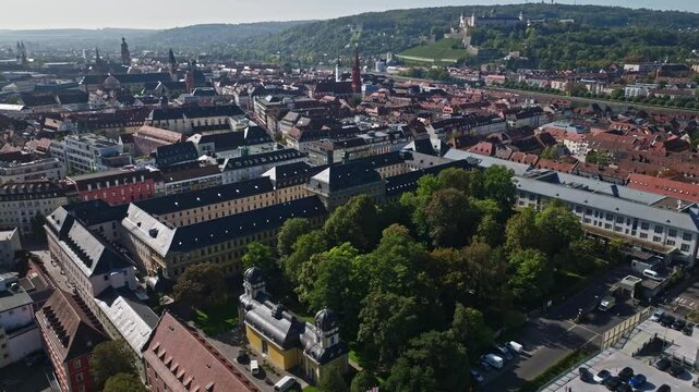 Aerial drone view of Stiftung Juliusspital W&uuml;rzburg, Germany. This architectural landmark features Baroque buildings, a grand courtyard, and lush vineyards. 