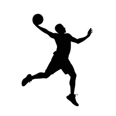 Silhouette of a basketball player making a jump shot during a game