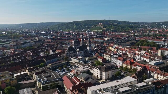 Aerial drone view of St. John in Stift Haug in W&uuml;rzburg, Germany, a historic Baroque church Located in the heart of W&uuml;rzburg, this landmark features a striking dome and twin towers . 
