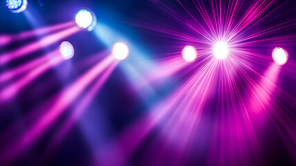 Obraz premium Stage lights shining brightly, illuminating the background with colorful beams of light, creating a vibrant atmosphere for a concert or event