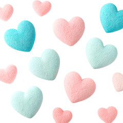 Obraz premium Pink and blue sugar hearts scattered against a black background.