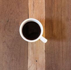 cup of coffee on wooden table