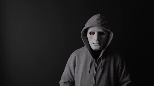 闇バイト、振り込め詐欺のなどの犯罪をイメージする仮面をした人物