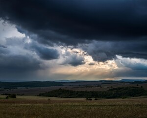Dramatic sky over dark landscape ominous clouds create mystery generated