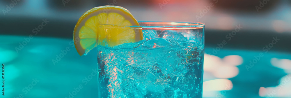 Poster enjoying a refreshing blue lagoon cocktail with a lemon wedge in a vibrant backdrop