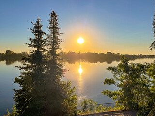 Columbia River flowing by a river bank in Richland, Washington at sunrise