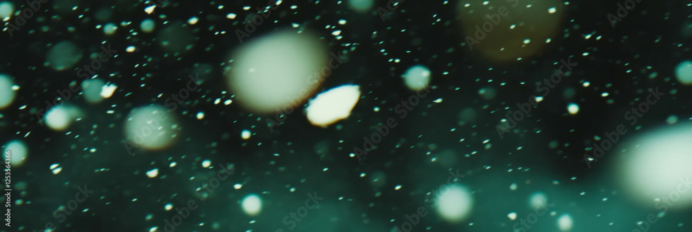 Poster Blurred texture of falling snow with soft bokeh circles in a bright background