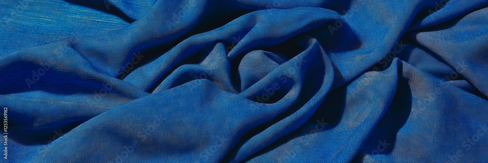Poster deep indigo cotton fabric with chambray weave on bright background showcasing texture