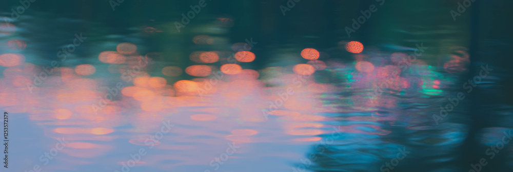 Poster droplets capture a blurred forest landscape with soft tones and bright background
