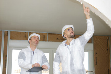 application of the plaster on the wall
