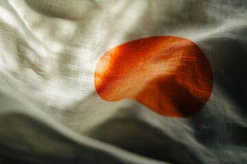 The Japanese flag softly blowing in the wind, highlighting its simplicity and central red circle