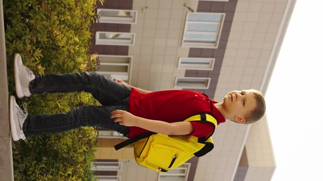 boy child kid backpack going school, schoolgirls with bags, friendship amongst pupils, girlhood, education companions, education preparation, students going to class, grassy schoolyard, backpacks on