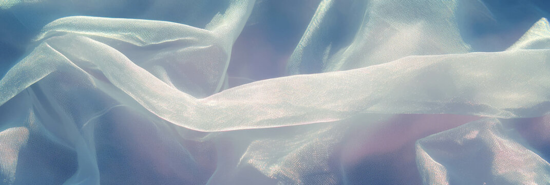 Light silver cotton fabric with batiste weave set against a bright background banner